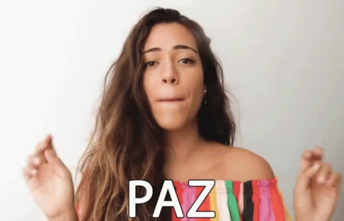 woman with rainbow stripes and text saying paz