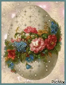 a painting of blue flowers on an egg