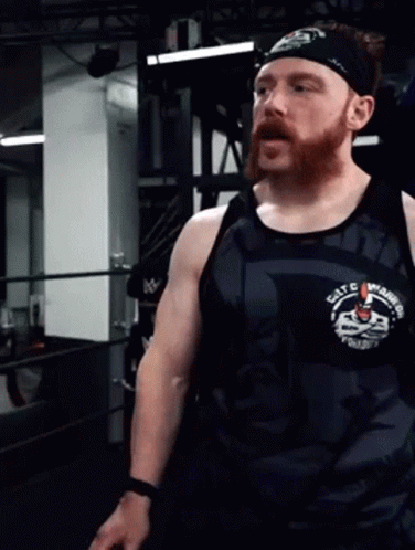 an image of man wearing a wrestling vest in the gym