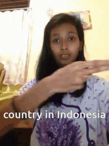 an asian girl with a hand in her hair and the text country in indonesia is in front of her