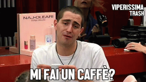 there is a male in a white shirt that says mmm faun cafe?