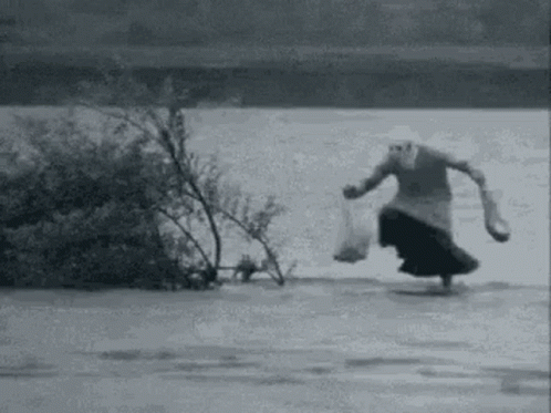 a man riding a skateboard down a river
