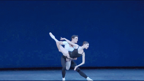 two people that are doing some ballet moves