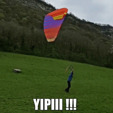 a person is holding the string of a kite