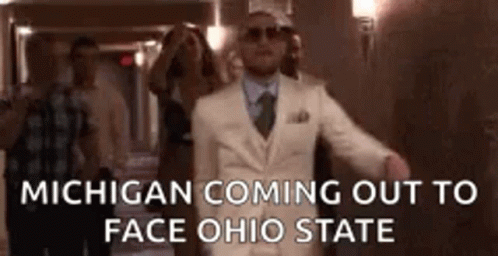 an ad for michigan coming out to face ohio state