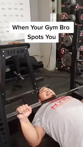 there is a man doing a bench press with the caption that reads, when your gym bro spots you