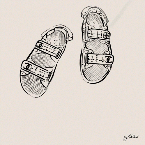 two children's shoes drawn in black and white
