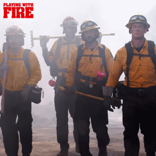 a group of people in uniforms are dressed in fire fighting gear