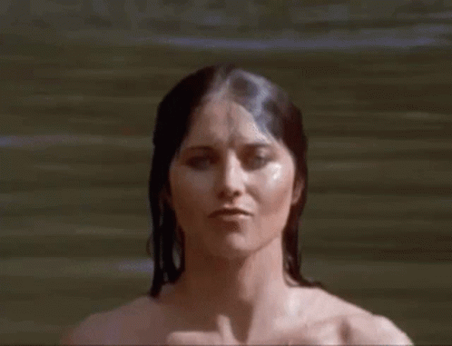 a woman with long hair is submerged in water