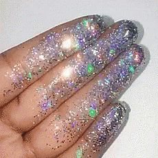 the fingers are holding a lot of glitter