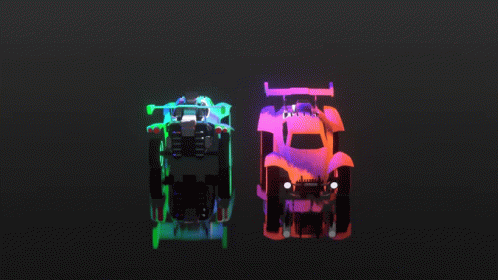 three cars are illuminated in neon colors