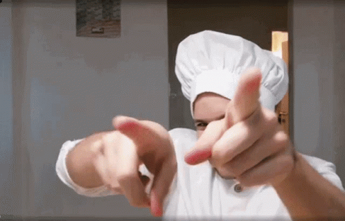 a man that is in the kitchen making gestures