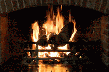a person jumping into a fireplace with their feet in the fire
