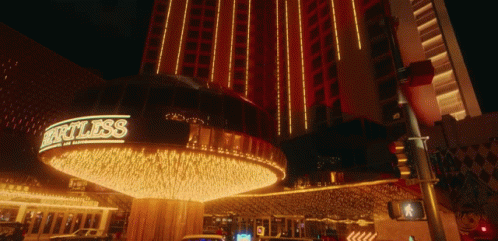 the entrance to a casino and resort in the night