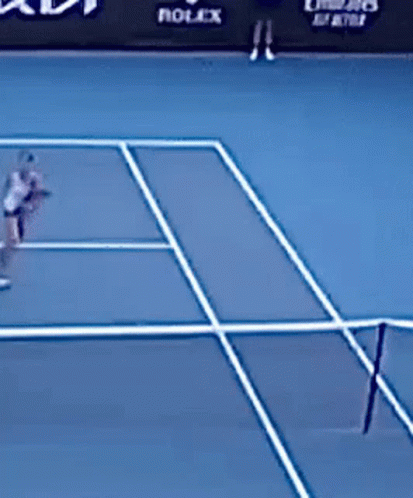 two people playing a tennis match together on the court