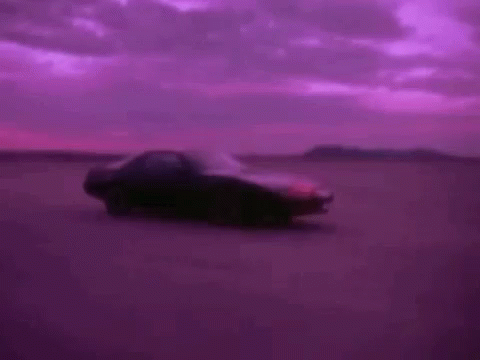 an image of a very nice car sitting in the middle of a purple cloud