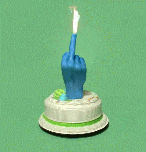 a cake with an object making the middle finger