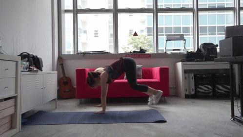 a person is doing a handstand in a room