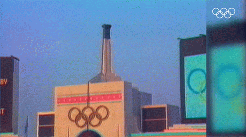 olympic stadium with tower and logo in foreground
