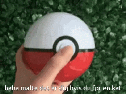 a hand is touching the center of a ball