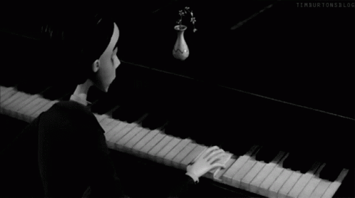 the image shows a piano player playing music