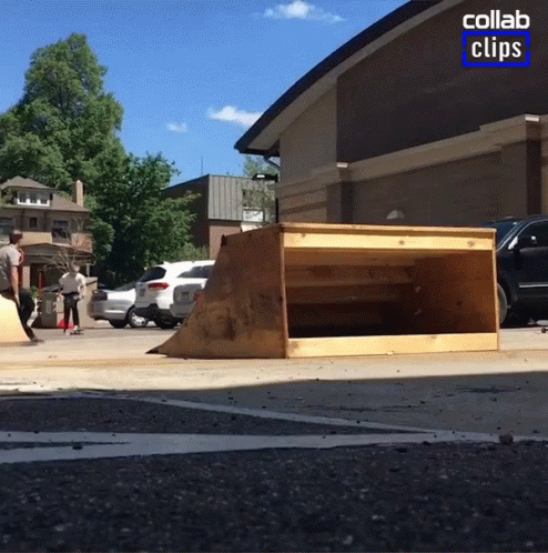 a small skateboard ramp is being used on the sidewalk