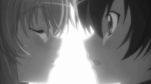 an anime couple staring at each other with their eyes wide open