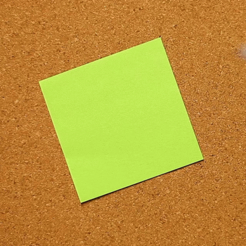 a close up of a piece of paper with one green square