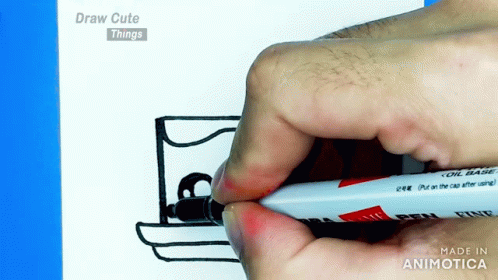 a hand is drawing soing on a white board