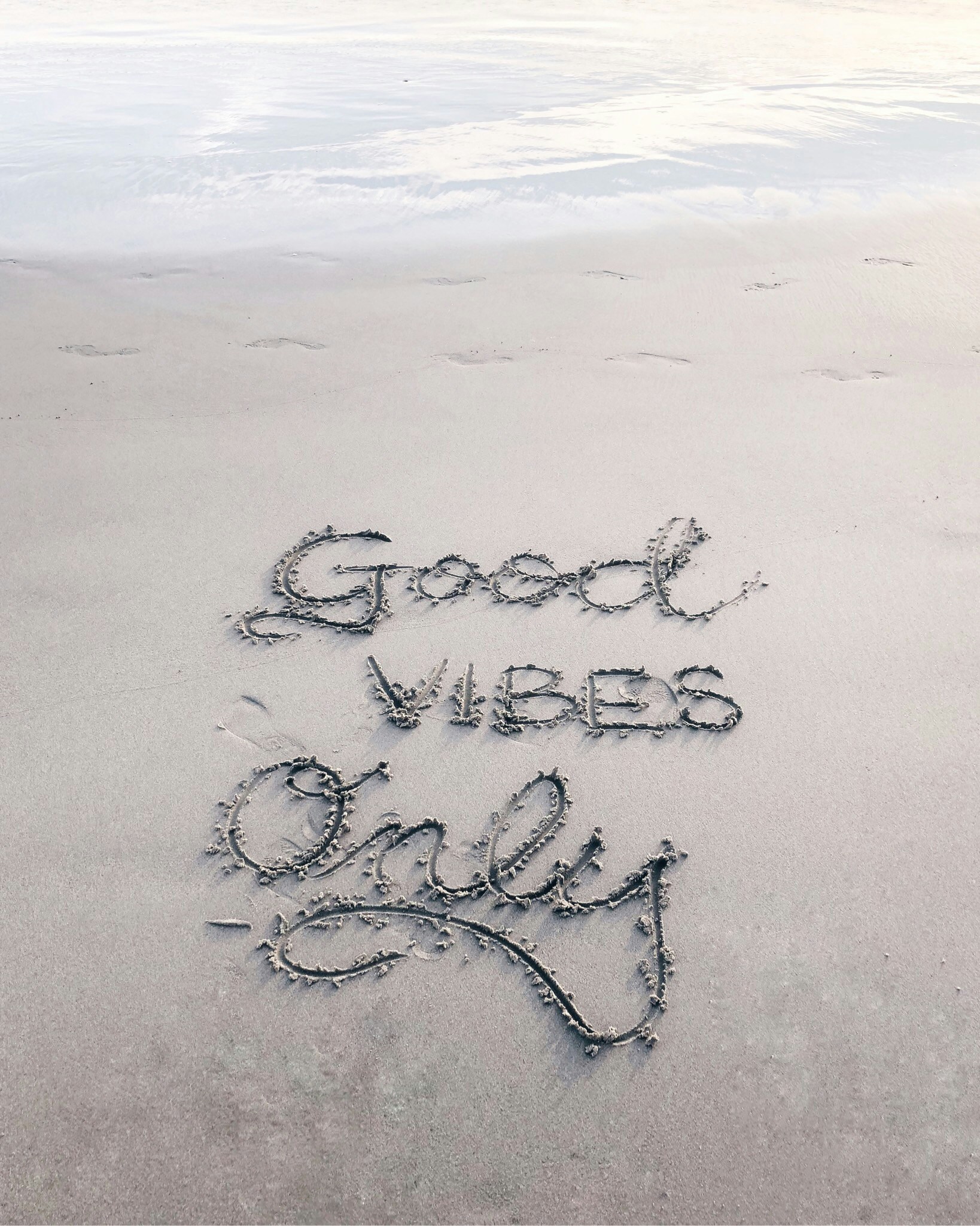 a handwritten quote saying good news at the beach