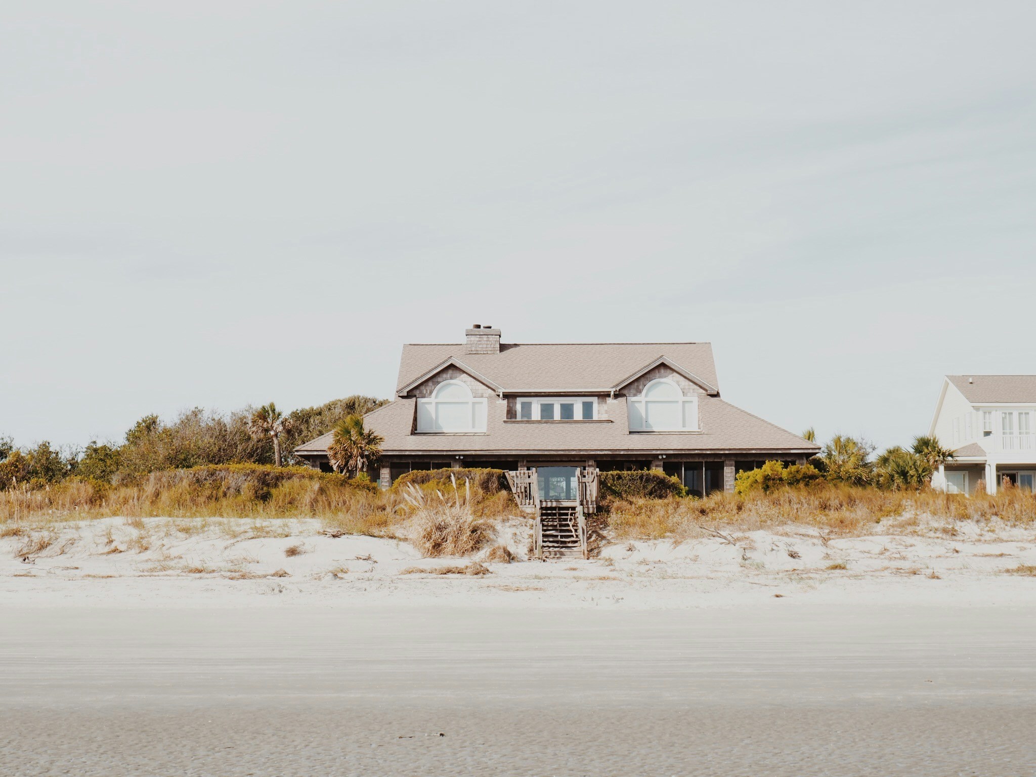 a big house on the beach in the daytime