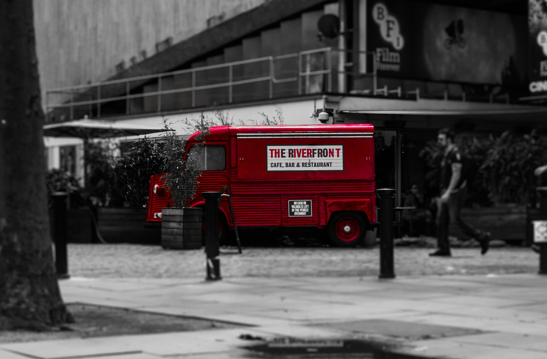 a red truck parked on a city street