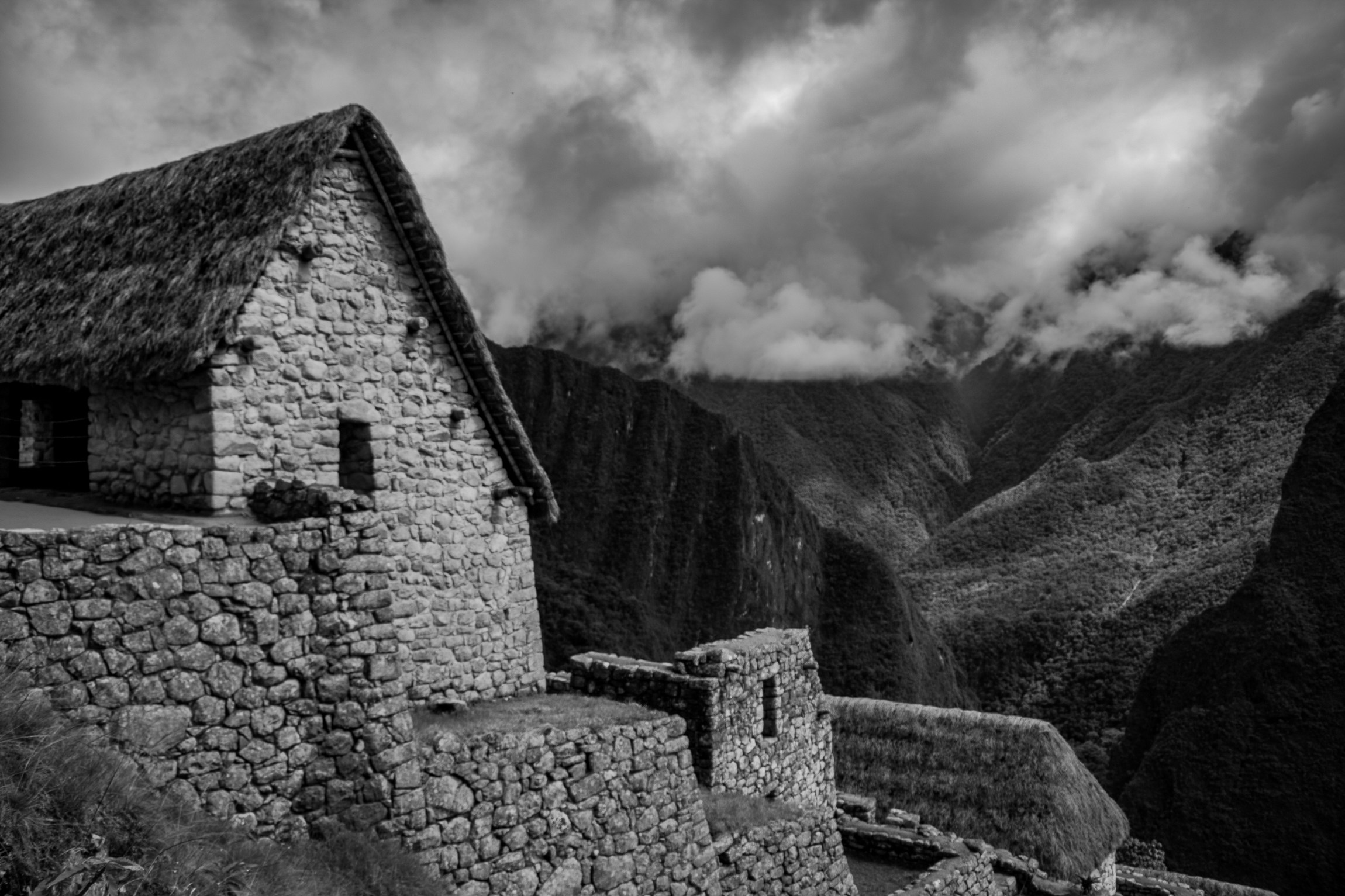 an old building overlooks an expansive valley