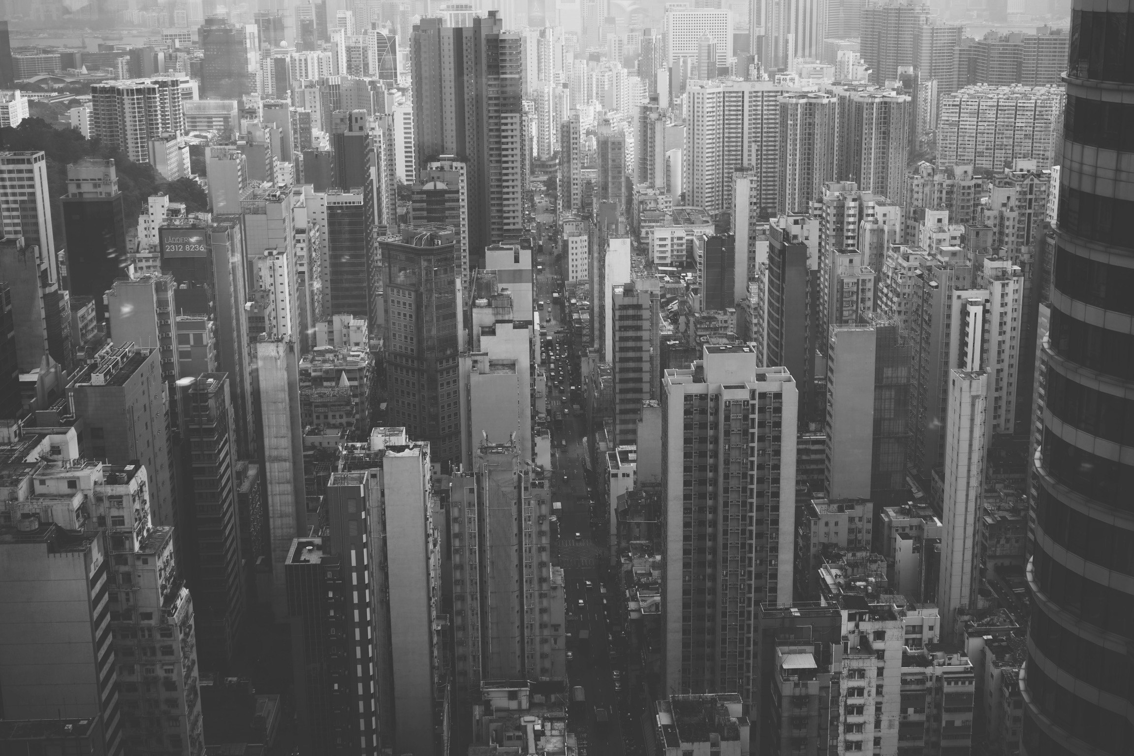 a black and white city scene of skyscrs with many floors