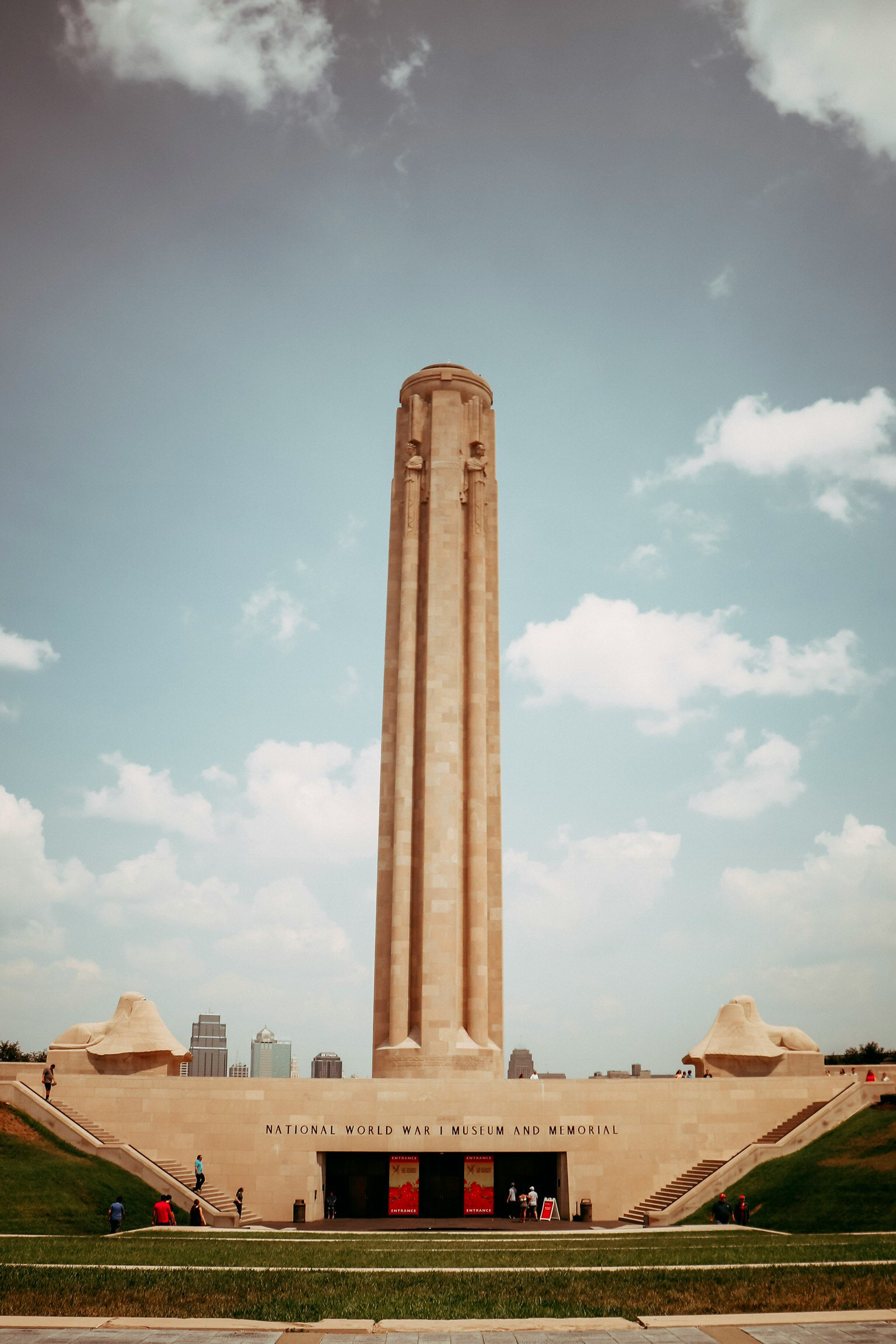 a very tall monument with stairs and an arch